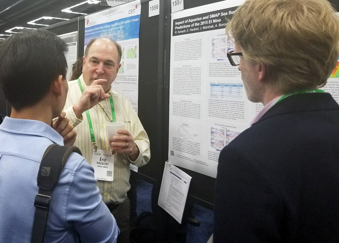 Eric Hackert with visitors to his poster presentation